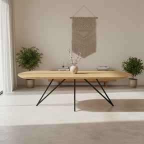 Eiken plat ovale eettafel met dunne ster poot Nijhuis Meubels